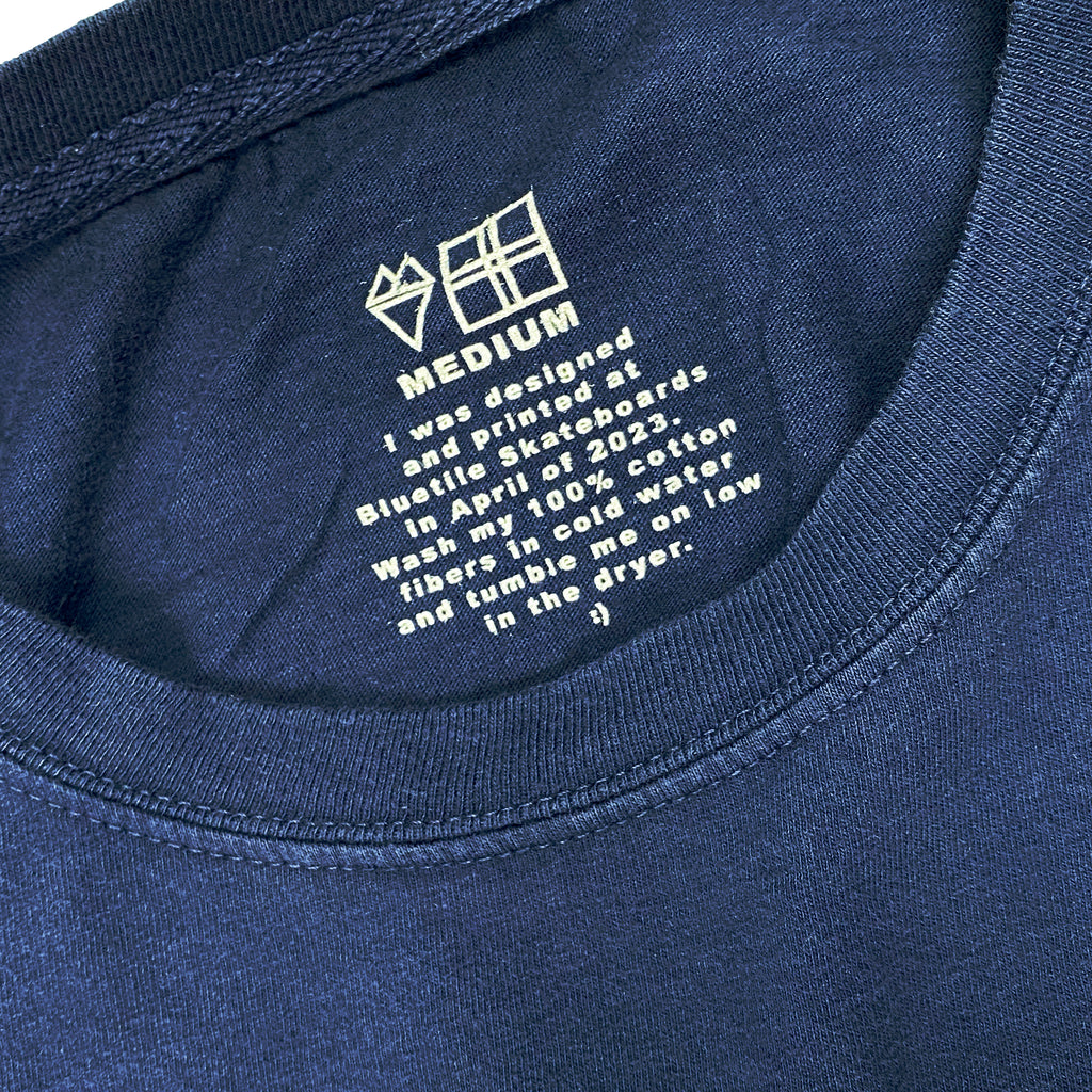 BlueTile Basic Shapes tee inside neck tag print that reads "wash in cold water, tumble dry on low."