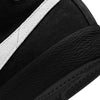 A close up of a nike black and white Nike SB Blazer Mid shoe.