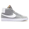 A pair of Nike SB Blazer Mid ISO Wolf Grey/White high top sneakers.