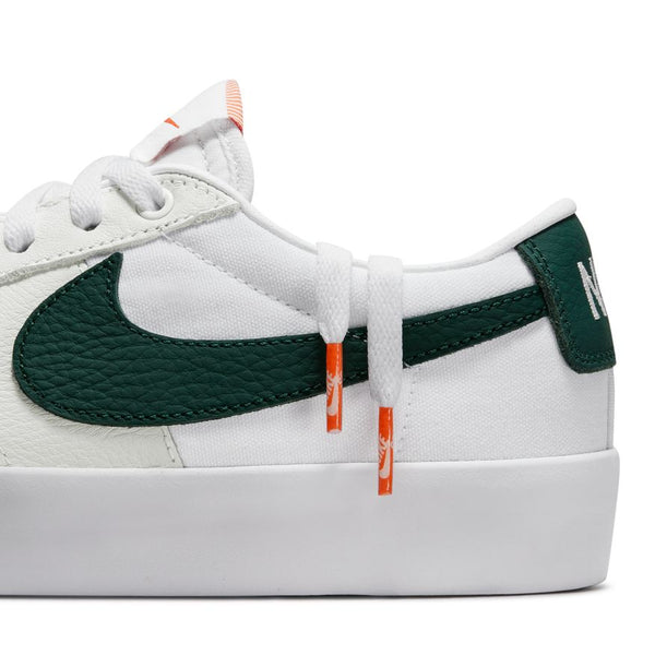 The NIKE SB BLAZER LOW PRO GT ISO WHITE / PRO GREEN is white and green.