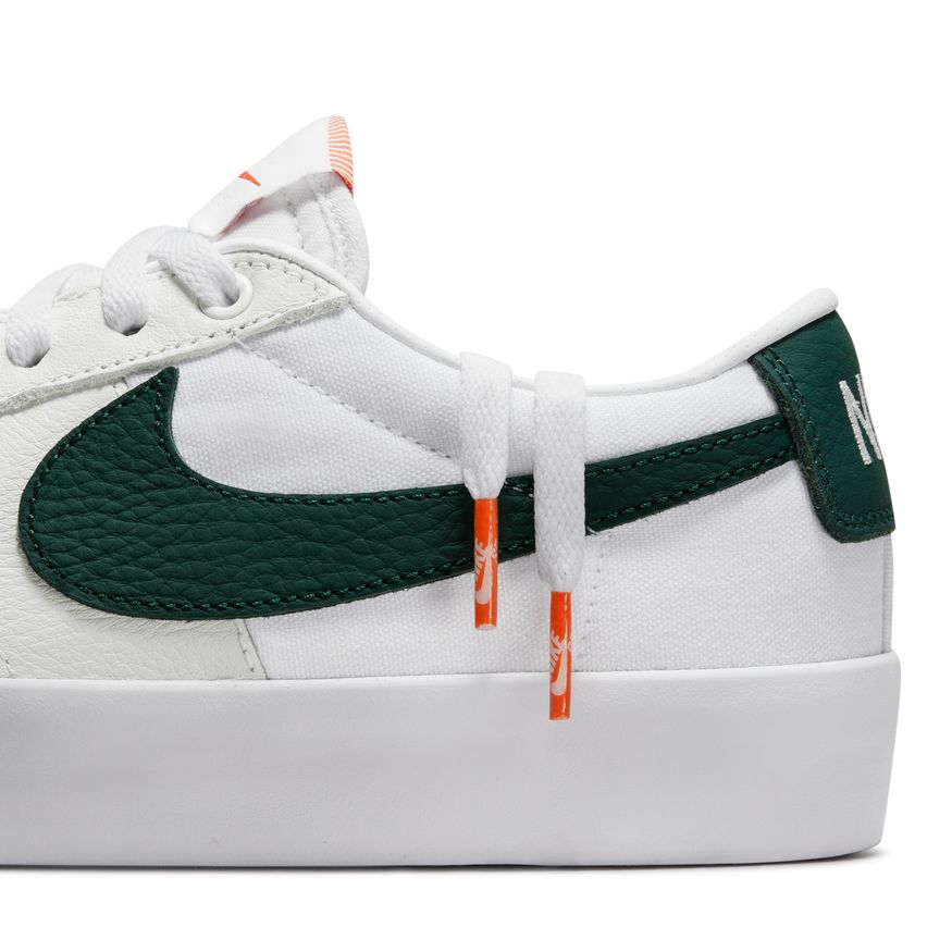 The NIKE SB BLAZER LOW PRO GT ISO WHITE / PRO GREEN is white and green.