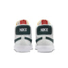 A pair of white and green NIKE SB BLAZER MID ISO ORANGE LABEL sneakers from nike.