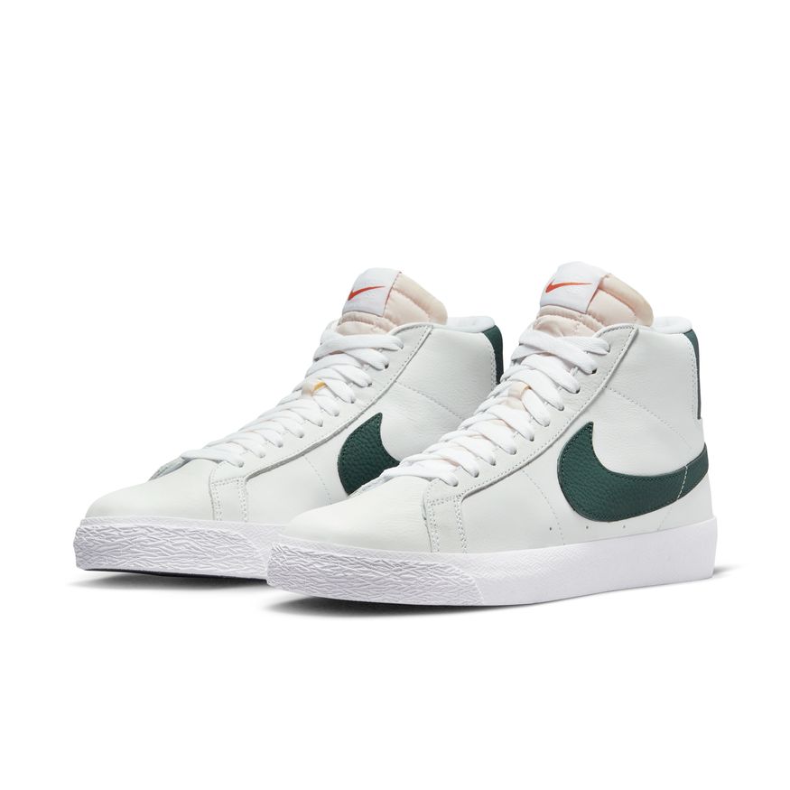 A pair of white and green Nike SB Blazer Mid ISO Orange Label White / Pro Green sneakers.