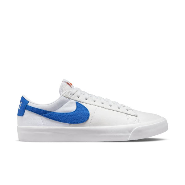 A white low-top sneaker featuring a blue Nike swoosh logo, blue heel accent, and white laces. This stylish pair is perfect for any skater and belongs to the NIKE SB BLAZER LOW PRO GT ISO WHITE / VARSITY ROYAL collection available at nike.