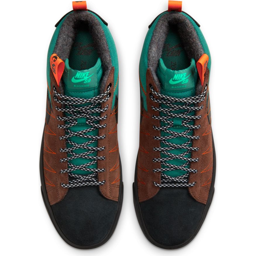 A pair of brown and green nike SB BLAZER MID PREMIUM NOBLE GREEN / BLACK shoes with laces.