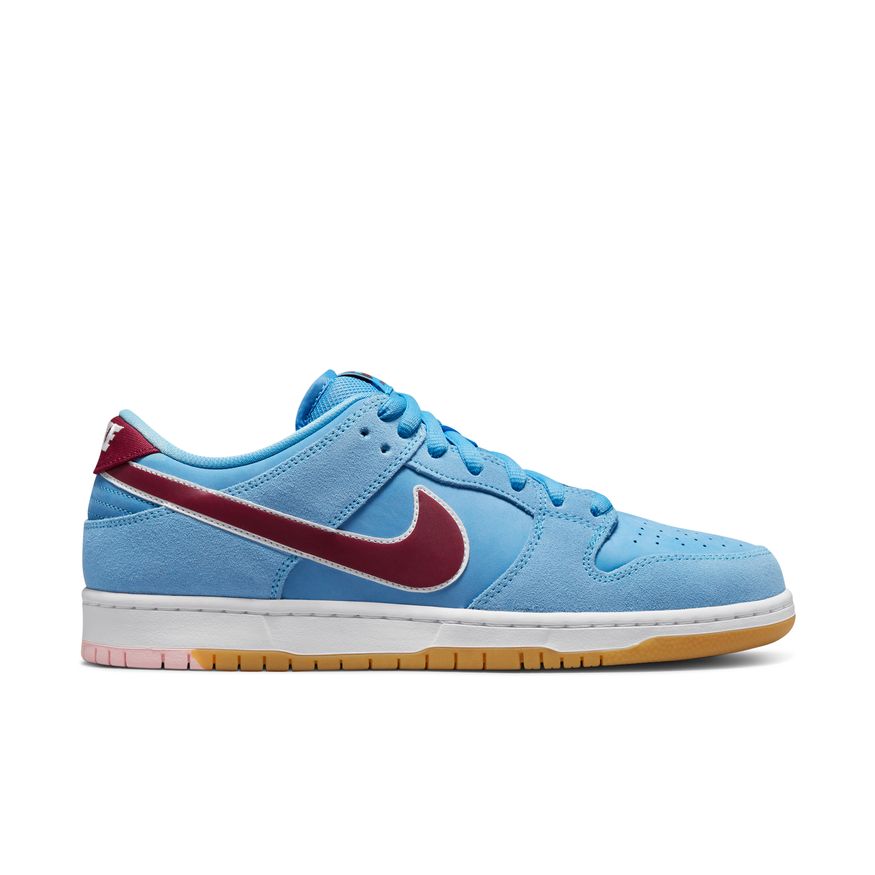 The Nike SB Dunk Low Pro "Phillies" Valor Blue/Team Maroon/White is a blue and burgundy sneaker, perfect for MLB fans looking to support the Phillies.