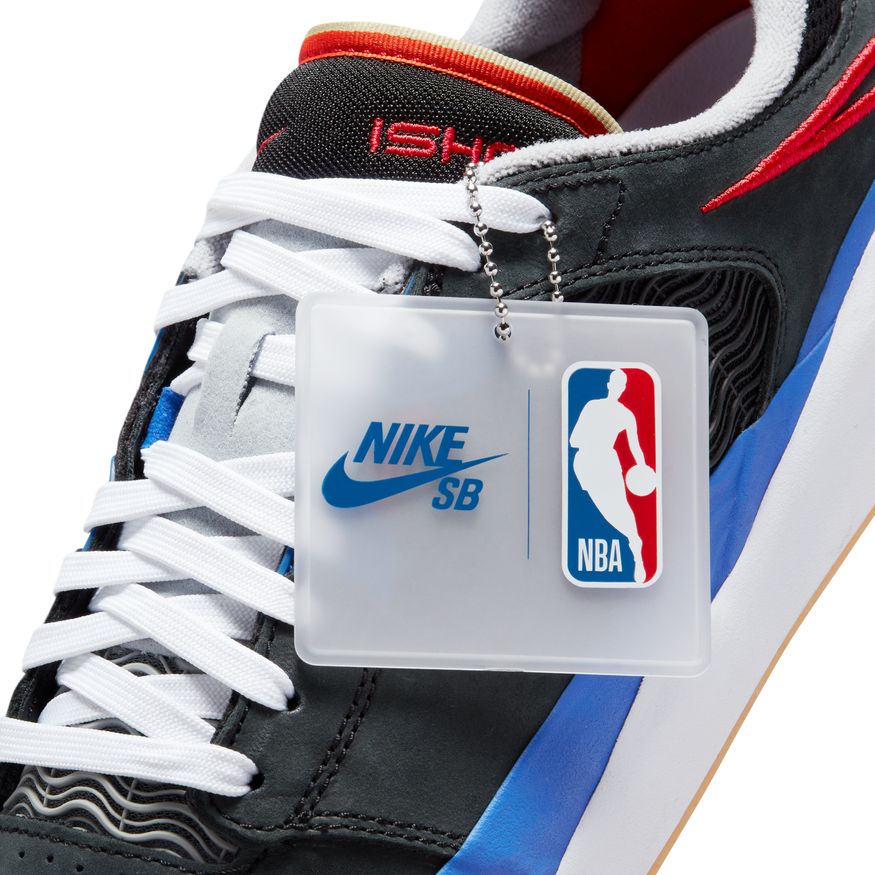 The Nike SB x NBA Ishod PRM Black / University Red-Hyper Royal skateboards have a tag attached to them.