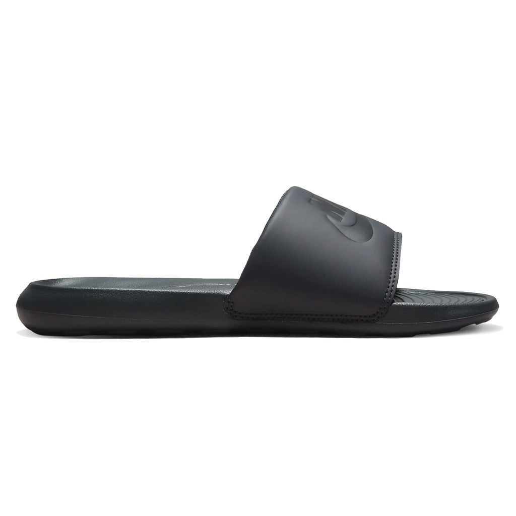 A pair of Nike SB Victor One Slides in Anthracite/Black on a white background.