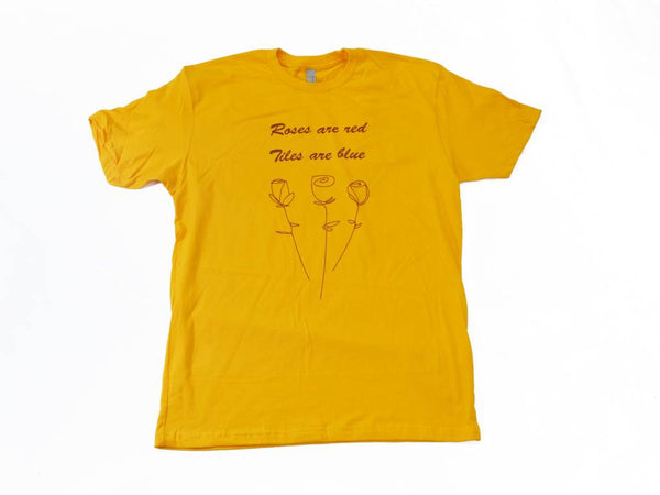 A BLUETILE VINTAGE ROSES T-SHIRT GOLD with a drawing of flowers by artist Irving Juarez.