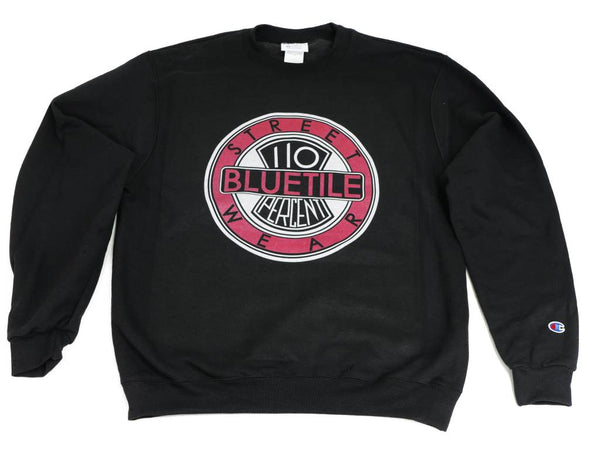 A BLUETILE 110% BLUETILE CREWNECK BLACK sweatshirt with a pink Bluetile Skateboards logo on it.