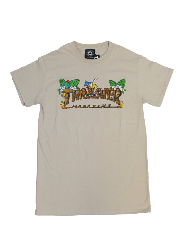 Product Name: THRASHER TIKI LOGO T-SHIRT SAND
Brand Name: THRASHER

Rewritten Sentence:
The sand-colored Thrasher Tiki Logo T-shirt from Thrasher, showcasing the bold "Thrasher Magazine" text in a graphic style with intricate leaf and sword illustrations.