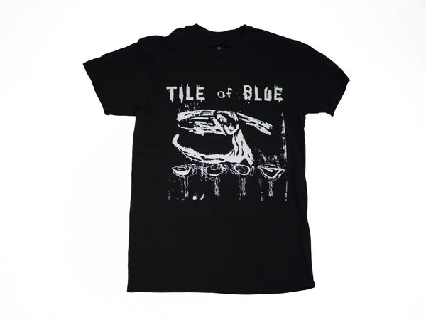 A black BLUETILE TILE OF BLUE T-SHIRT BLACK with the words "BLUETILE" on it by Bluetile Skateboards.
