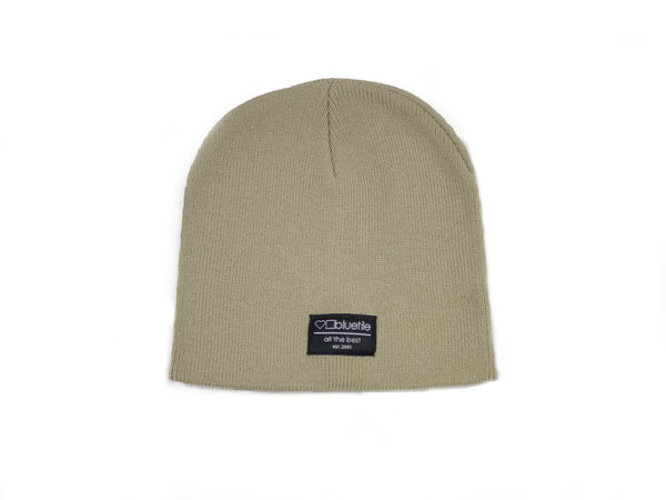 A BLUETILE SURPLUS UNCUFF BEANIE TAN by Bluetile Skateboards on a white background.