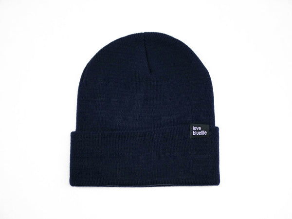 A Bluetile Skateboards Love Always beanie navy on a white background.