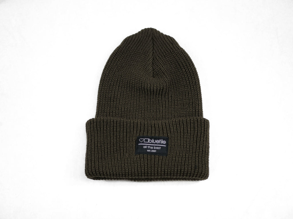 A Bluetile Skateboards olive green knit beanie on a white background.