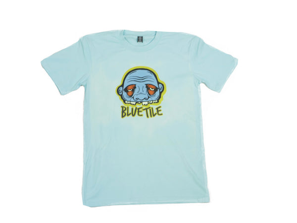 A BLUETILE YUPYUK TOTEM T-SHIRT TEAL with a cartoon face on it.