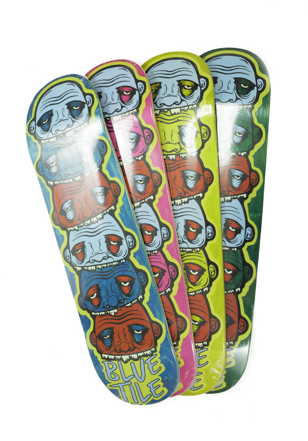 A set of skateboards with different faces on them, including the BLUETILE YUPYUK TOTEM 8.75 (VARIOUS STAINS) design by Bluetile Skateboards.