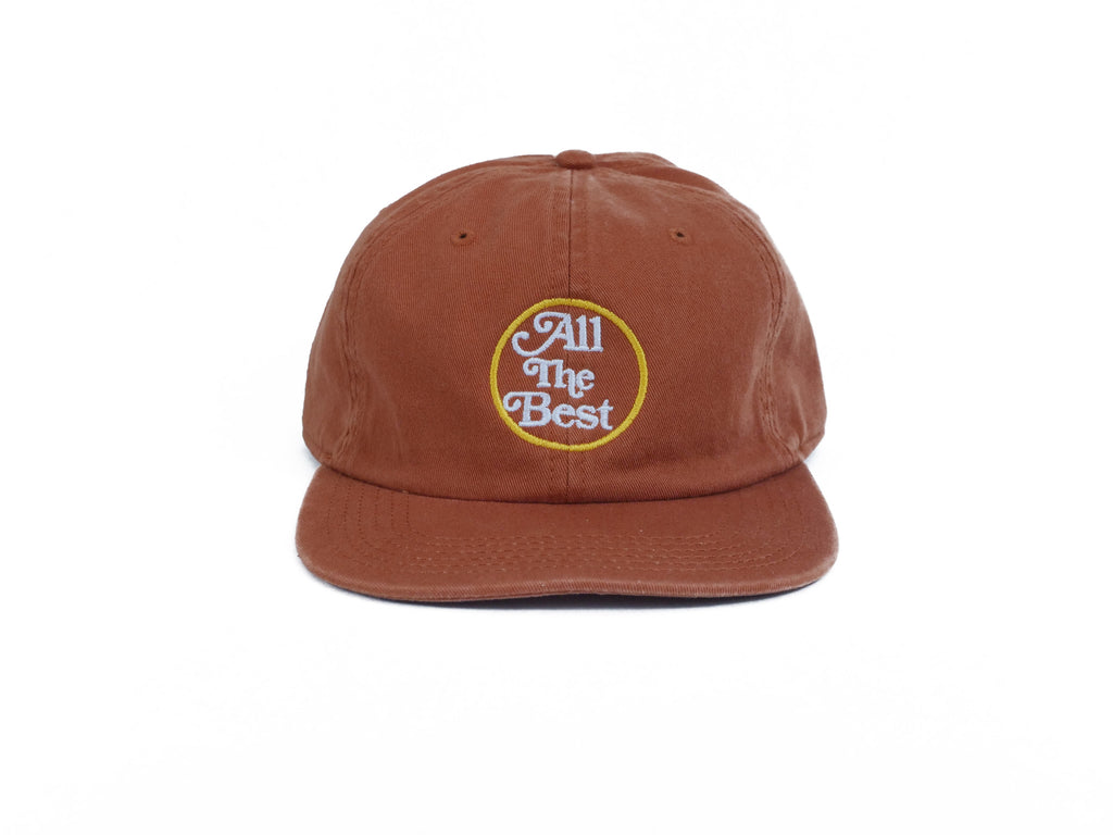 An Bluetile Skateboards UNSTRUCTURED brown hat with the words 'all the best' embroidered on it.