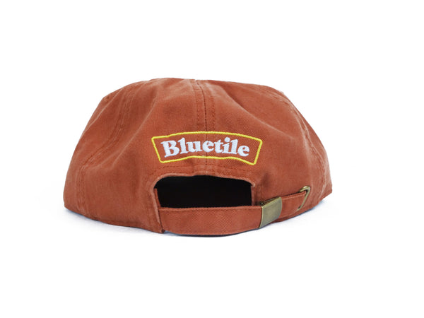 A BLUETILE ALL THE BEST UNSTRUCTURED HAT COPPER with the word bludie on it.
