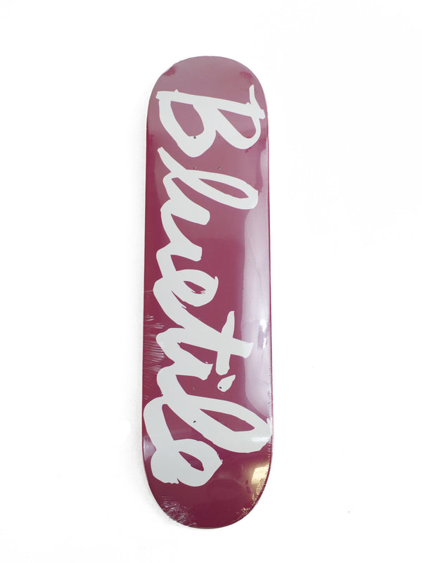 A maroon skateboard with a BLUETILE CURSIVE LOGO GARNET (VARIOUS SIZES) in white.