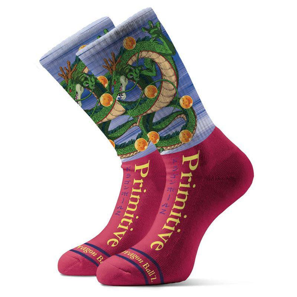 The PRIMITIVE X DRAGONBALL Z SHENRON SOCK by Primitive features a green dragon and orange orbs on blue, plus yellow "Primitive" text on a red lower half with Dragon Ball Z branding.