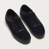 A pair of HOURS IS YOURS HERMAN CODE BLACK/BLACK sneakers on a white surface.