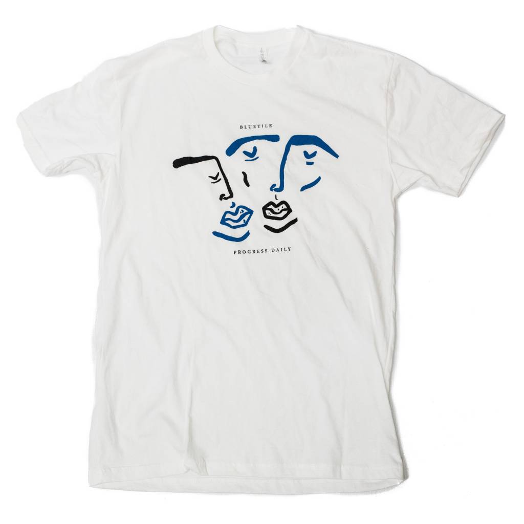 An Exclusive BLUETILE X PROGRESS DAILY TWO COLOR WHITE t-shirt with two faces drawn on it. (Bluetile Skateboards)