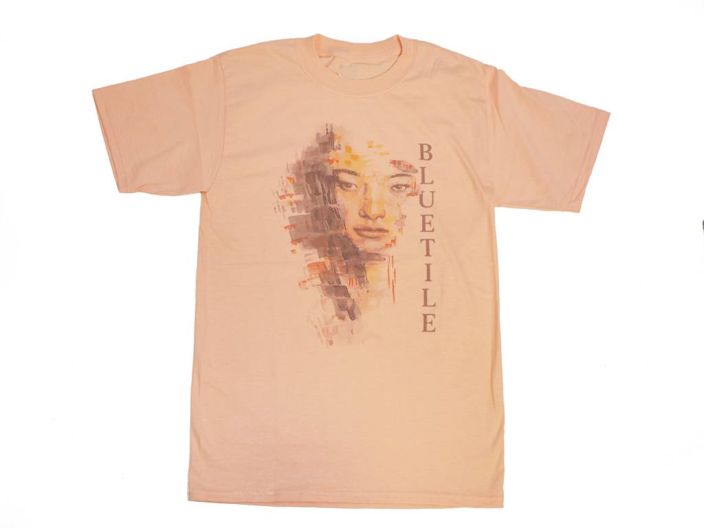 A BLUETILE WATER COLOR T-SHIRT CANDY ORANGE with a woman's face on it, from Bluetile Skateboards.