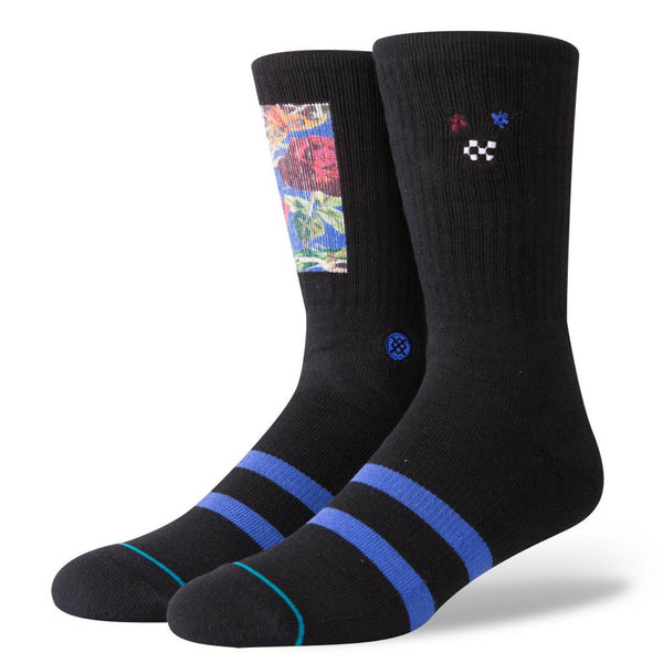 A pair of black crew STANCE SOCKS POET LARGE with blue stripes and a unique floral pattern on the upper part, featuring a small skull and butterfly emblem.