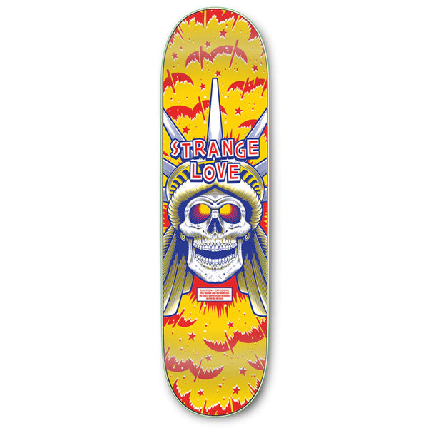 The STRANGE LOVE LIBERTY *SIGNED skateboard deck from STRANGELOVE features a striking graphic of a skull with glowing eyes, adorned with a statue-like headdress, and the text "Strange Love" prominently displayed above it, all set against a vibrant yellow and red background. This distinctive piece is autographed by Sean Cliver and showcases the exclusive STRANGE LOVE CODE BLUE design.