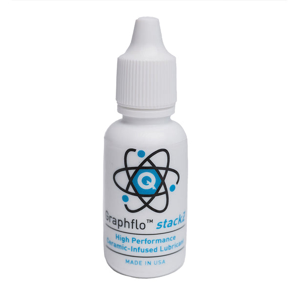 A bottle of QUANTUM GRAPHFLO STACKZ LUBRICANT by Quantum Bearings on a white background, proudly crafted by USA based manufacturers.