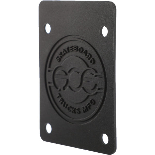 The ACE SHOCK PADS 1/16" BLACK by ACE are black, rectangular skateboard shock pads with four holes and "ACE SKATEBOARD TRUCKS MFG" embossed on them.
