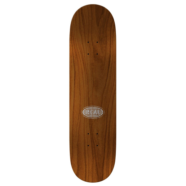 The REAL HERMANN CATHEDRAL HOLOGRAPHIC is an 8.38" wooden skateboard deck with a natural finish and a holographic rainbow foil oval "REAL" logo at the center.