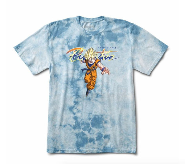 The PRIMITIVE x Dragon Ball Z Nuevo Goku Saiyan Tee in Slate Wash features a blue tie-dye design with an orange-and-blue Goku graphic and "Primitive" text above.