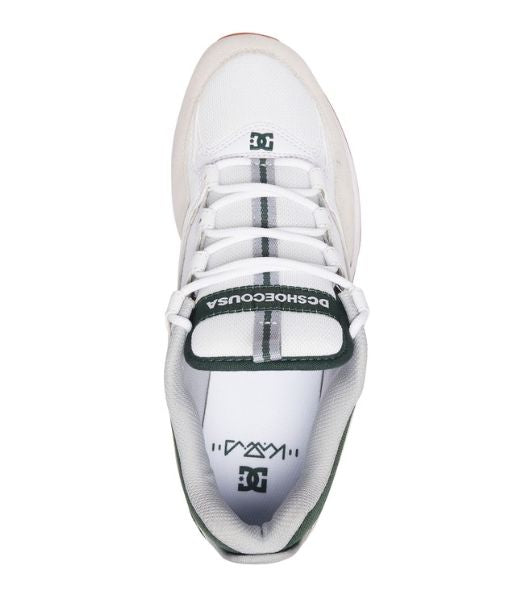 A white and green DC Kalis Lite shoes by DC on a white background.