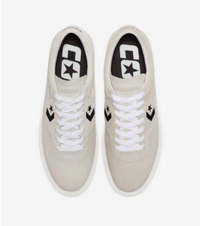 A pair of white CONVERSE LOUIE LOPEZ PRO OX sneakers with a star on the side, perfect for those who appreciate a great shoe.
