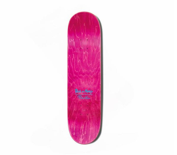 The PRIMITIVE X RICK & MORTY RODRIGUEZ RICK skateboard deck by PRIMITIVE features a pink finish with visible wood grain and blue center text, shown vertically on a white background.