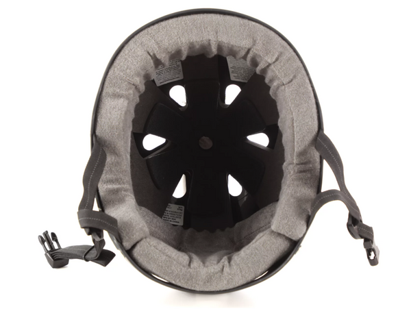 Top-down view of the 187 PRO SWEATSAVER HELMET MATTE CHARCOAL by 187, featuring padded lining, ventilation holes, and adjustable chin straps with buckle. Available in Small to X Large for a comfortable fit.