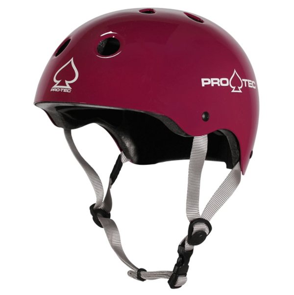 A pink helmet with a white ProTec logo on the front and side.