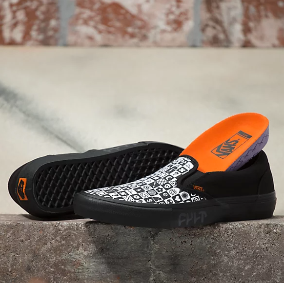 VANS X CULT SLIP ON PRO BLACK CHECKER shoes in black and orange with a touch of BLACK CHECKER pattern.