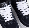 A pair of black and white VANS HALF CAB NAVY / WHITE sneakers with laces.