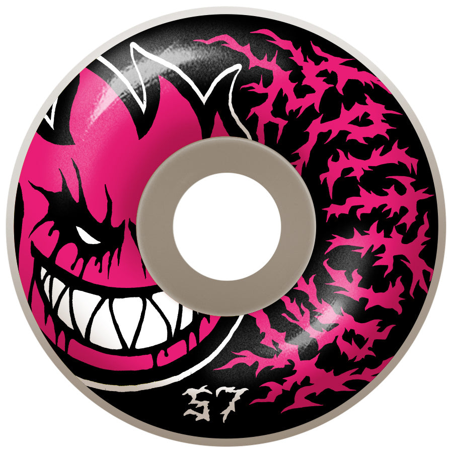 A pink and black SPITFIRE skateboard with an evil face.