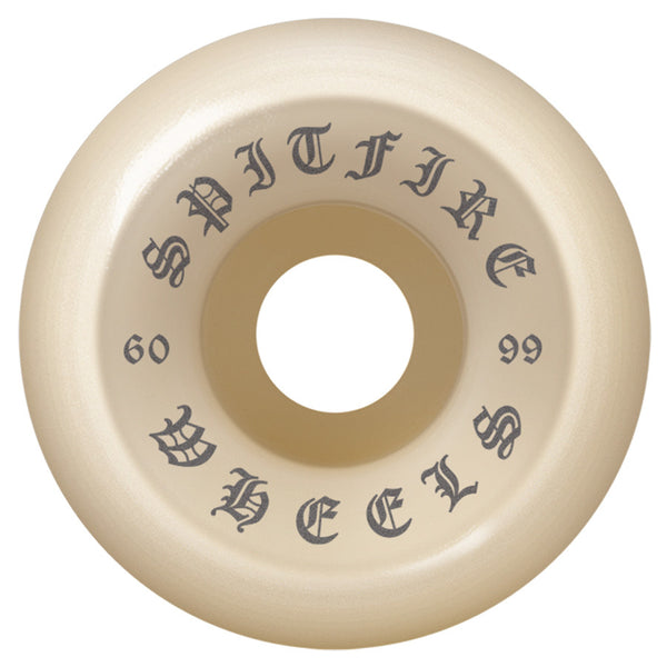 The SPITFIRE O.G. CLASSICS 99A 60MM skateboard wheel features a beige color and "SPITFIRE WHEELS," "60MM," and "99" in black gothic font around the center hole—part of the CLASSICS collection.
