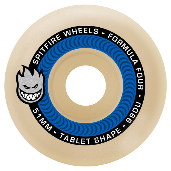 The SPITFIRE FORMULA FOUR TABLETS 99D 51MM skateboard wheel features a blue spiral, black band with "Spitfire Wheels - Formula Four - 99DU - 54MM - Tablet Shape," and the iconic flame-face logo.