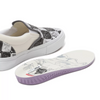 VANS SKATE ERA DANIEL JOHNSTON RAVEN SLIP-ON sneakers with a white and purple sole.