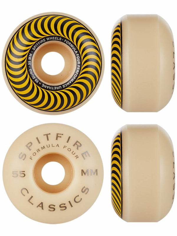 Four beige skateboard wheels display yellow and black spirals with the text "SPITFIRE F4 CLASSIC 99D 55MM." These wheels merge style and performance for skating enthusiasts.