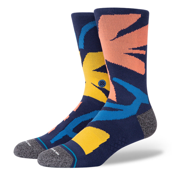A pair of colorful abstract-patterned STANCE SOCKS ARCHIVES NAVY LARGE with reinforced heel and toe areas, sized large.