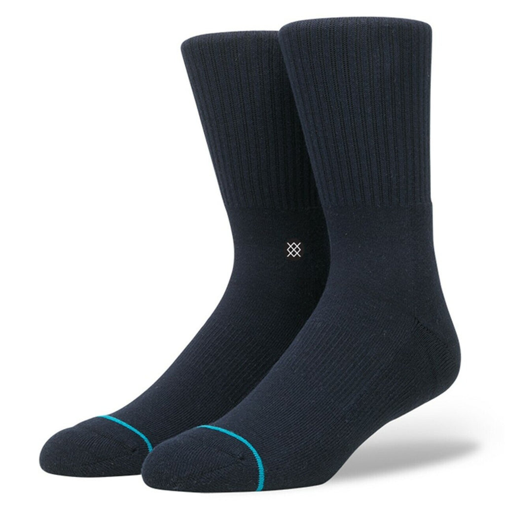 A pair of dark navy STANCE SOCKS ICON with contrasting light blue toe accents against a white background.