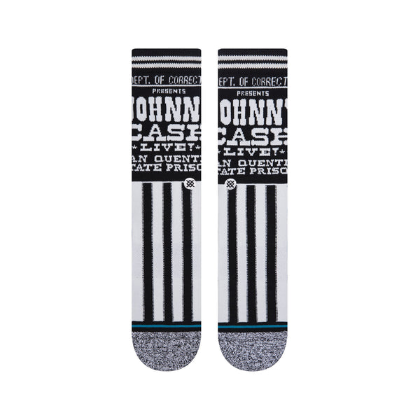 A pair of STANCE SOCKS JOHNNY CASH CORRECTIONS LARGE with a black and white prison stripes design and "Johnny Cash Dept. of Corrections" text.