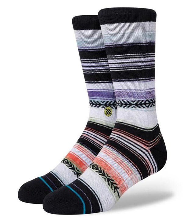 A pair of Stance Reykir Lime Large socks featuring a mix of horizontal stripes and geometric designs.
